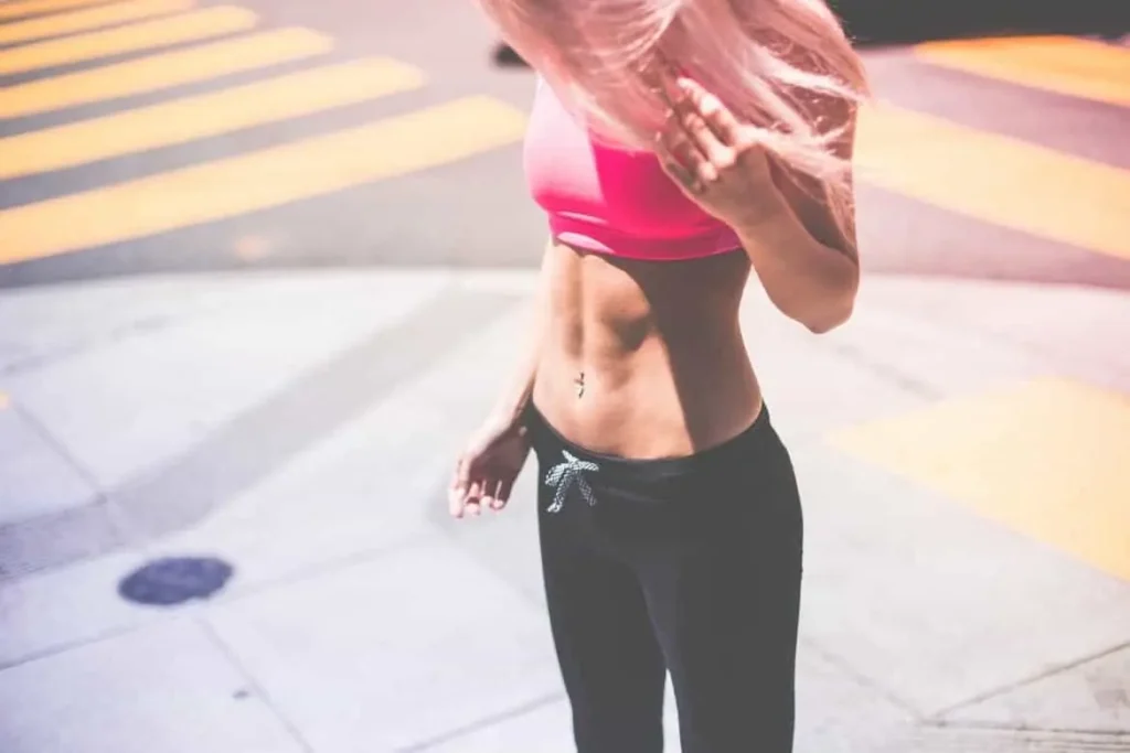 Woman with toned stomach after LA-EMS Body Sculpting Treatment Oxshott